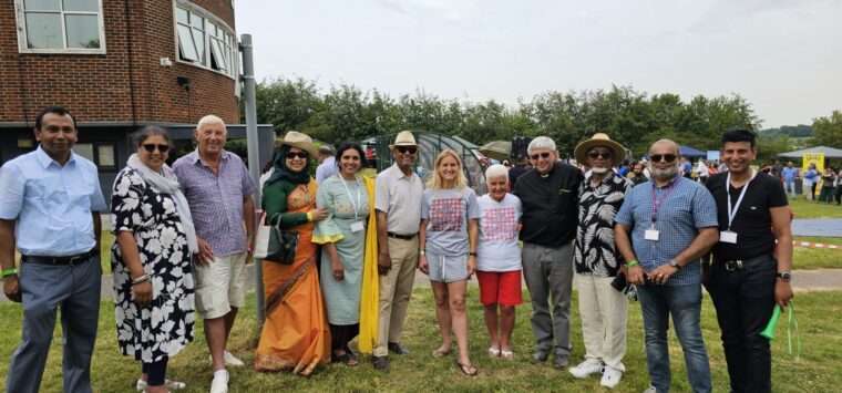 Group of picnic attendees posing for a photograph
