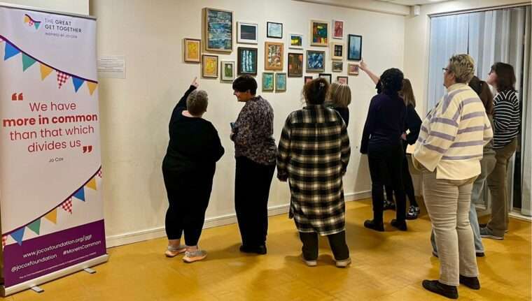 Visitors to the Nottingham Great Winter Get Together art exhibition view the artworks on display